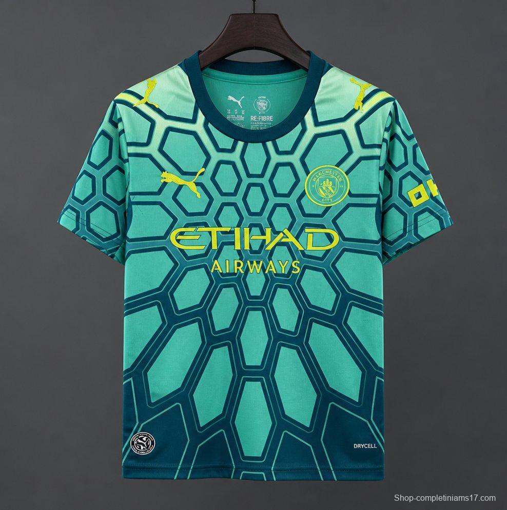 26/27 Manchester City Vibrant Green Goalkeeper Jersey With Dark Blue Geometric Pattern.